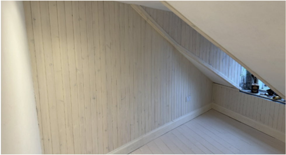 Photo of finished shiplap in loft area