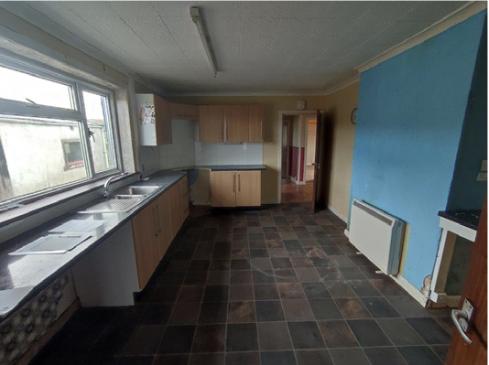 Photo of kitchen in disrepair